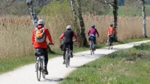 Four people cycling along a track